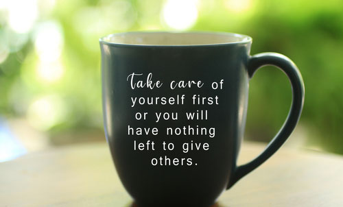 mug with "take care of yourself" message on side